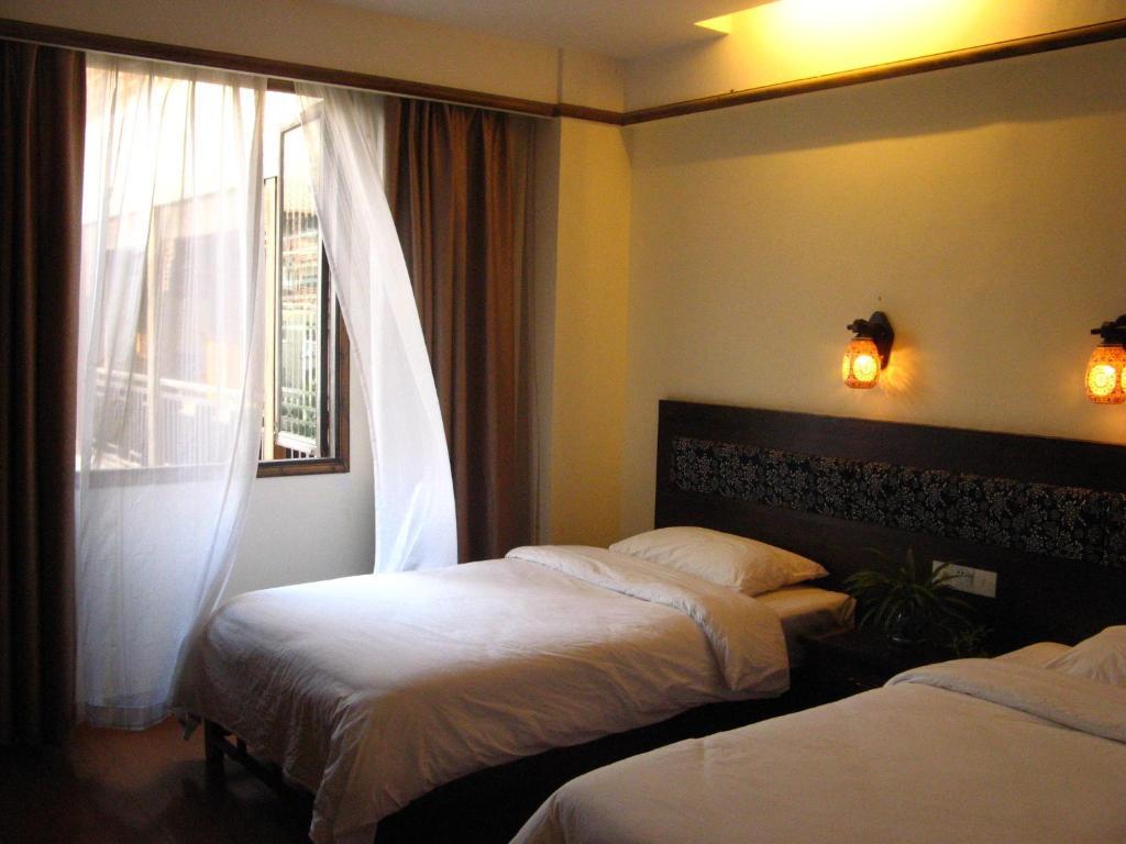 Bajie Youth Hostel Zhangjiajie Quarto foto